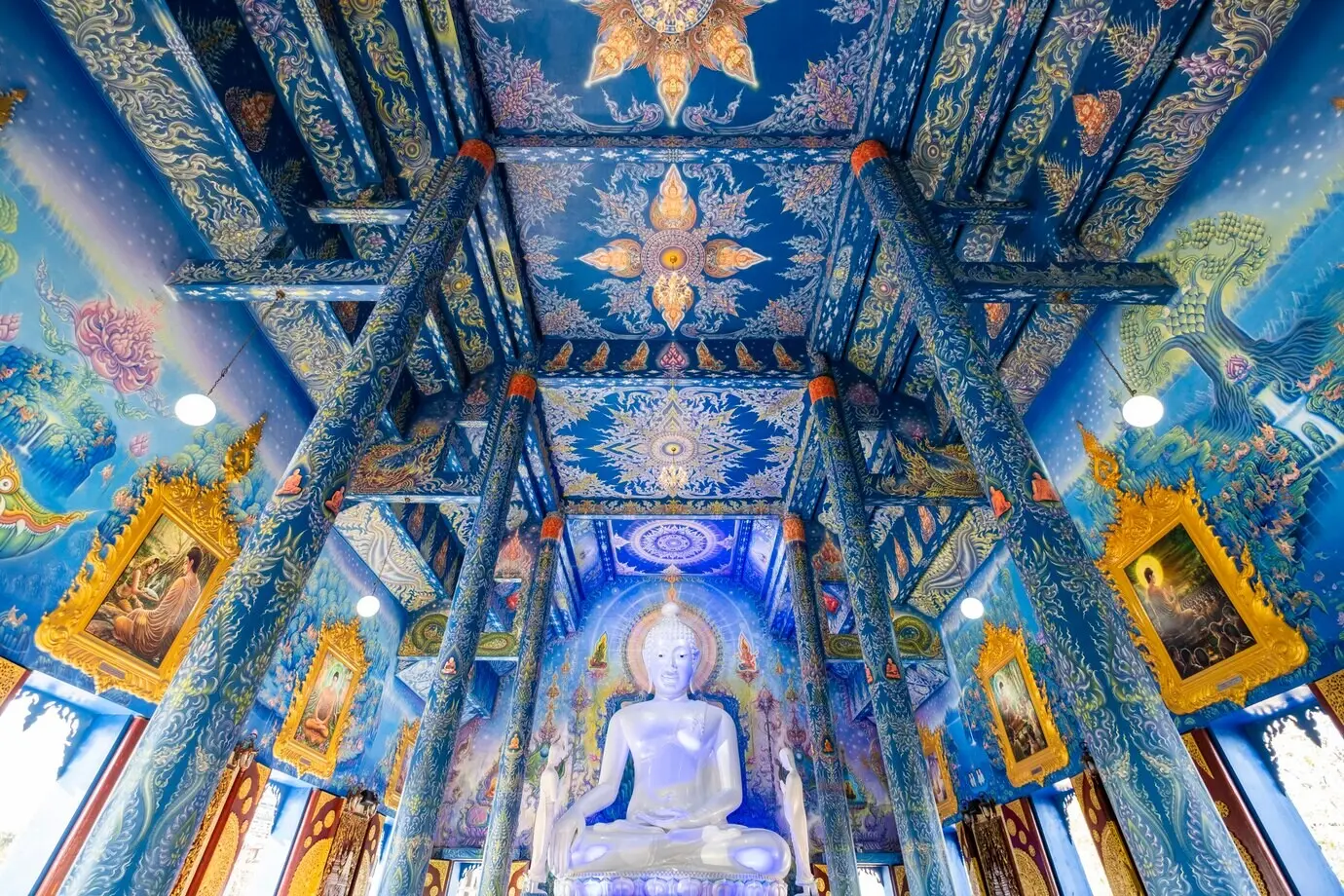 Interior of Wat Rongseaten featuring blue painting and luxurious architecture in Chiang Rai, Thailand.